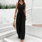 Jumpsuit mit V-Ausschnitt und Taillenbinde